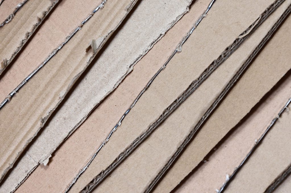Background image with a lot of beige cardboard paper