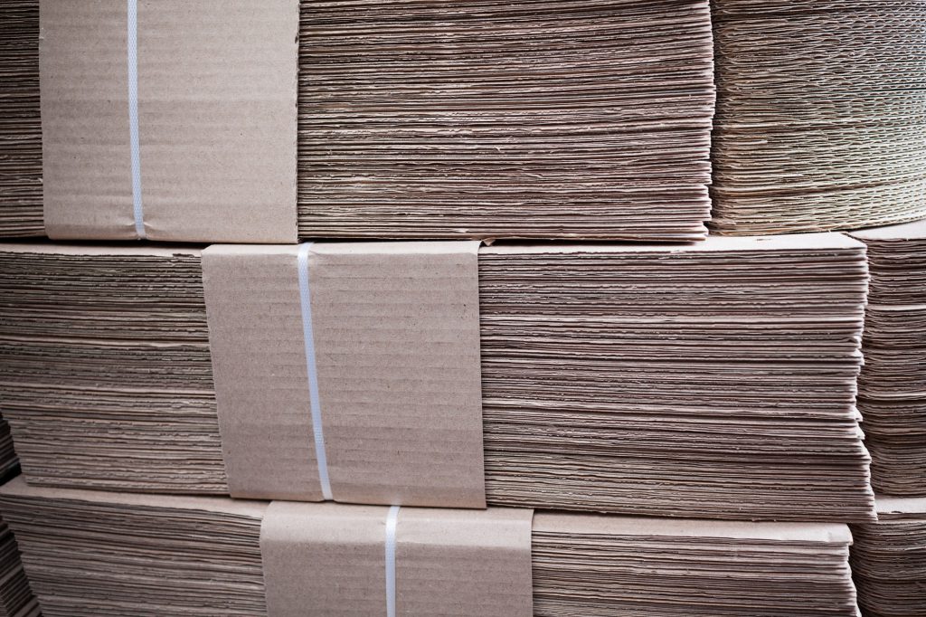 Close-up large cardboard piles lie on top