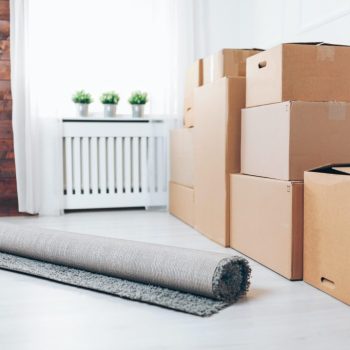 Moving concept. Room with cardboard boxes